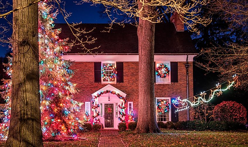 A colonial house is illuminated by Christmas lights after the holiday season in Santa Claus, Indiana