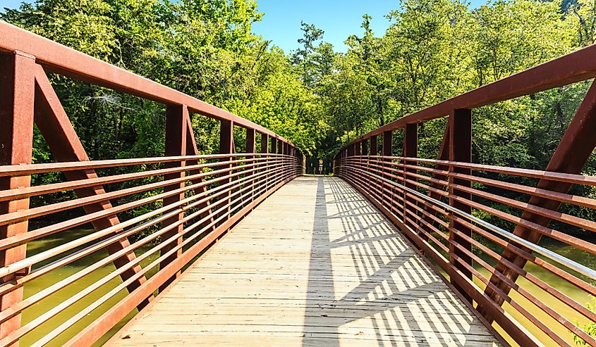 A steel and concrete bridge over the Little River in Woodstock, Georgia park