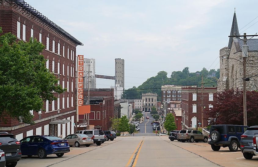 Views of Alton, Illinois, from the middle of the street, flanked by city buildings
