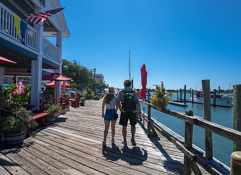 Couple on a summer vacation enjoying a walk by the waterfront in Beaufort, North Carolina.
