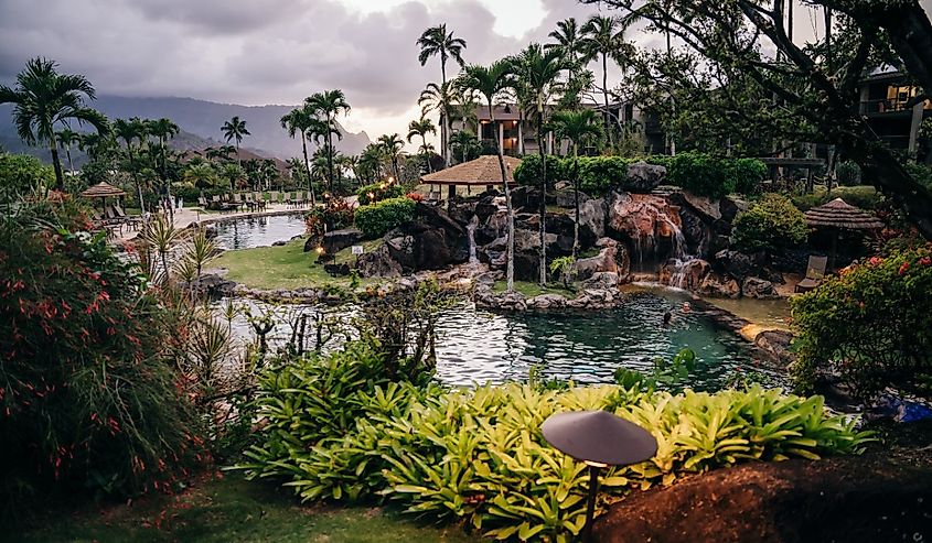 The Westin Resort pool and cabana at sunset in Princeville, Hawaii.