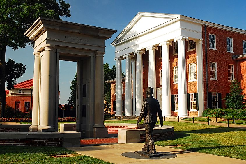Statue of James Meredith, the first African American to attend the University of Mississippi, walking through an open door, located in Oxford, Mississippi, USA.