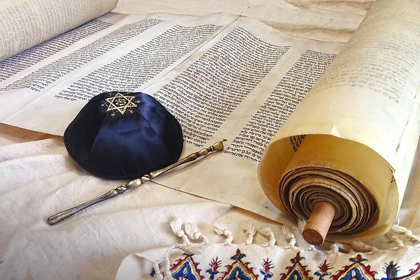 The Hebrew handwritten Torah, on a synagogue alter, with Kippah and Talith