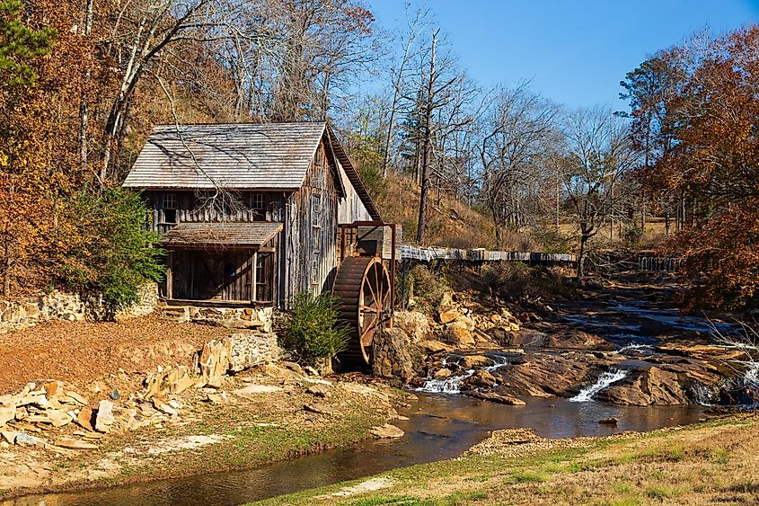 Historic Sixes Mill from the 1800s in Canton, Georgia, during autumn.