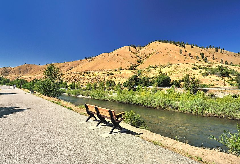 A bench in a riverfront park near Cashmere, WA. 