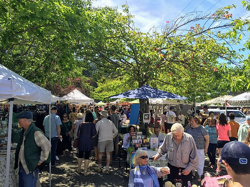 Ganges, Saltspring Island, Canada: A group of locals and tourists explore the Ganges Sunday market on beautiful Saltspring Island. Islands markets are an increasing tourist attraction