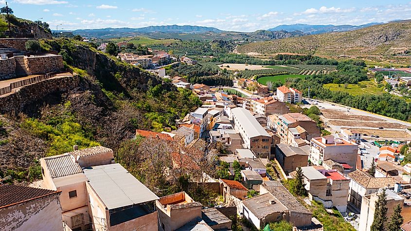Aerial view of Loja, Andalusia, Spain, with the Church of the Incarnation, the Moorish Alcazaba, and Gorda Peak in the background
