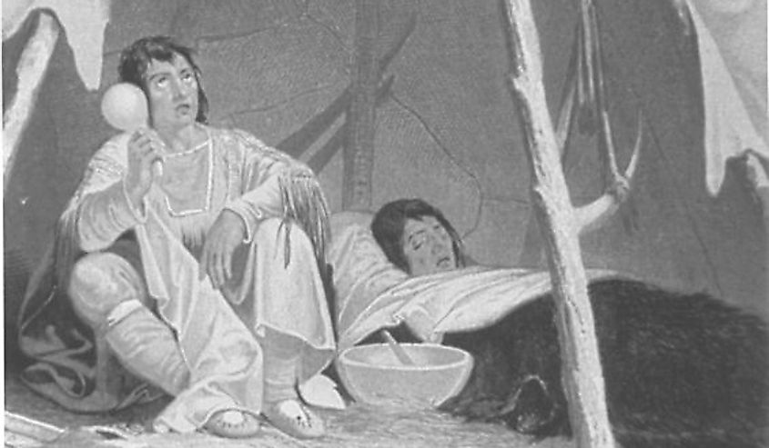  This is an engraving showing a Native American medicine man caring for an ill Native American.