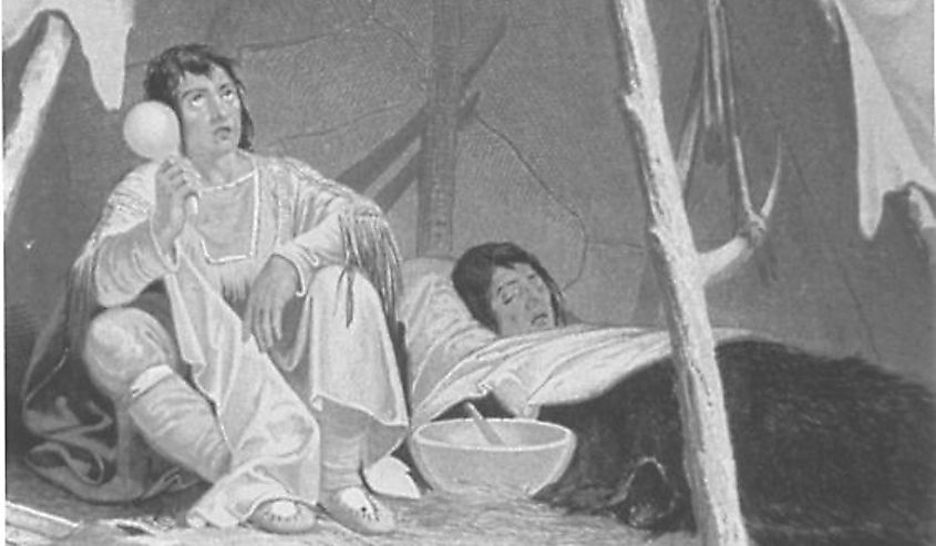 This is an engraving showing a Native American medicine man caring for an ill Native American.