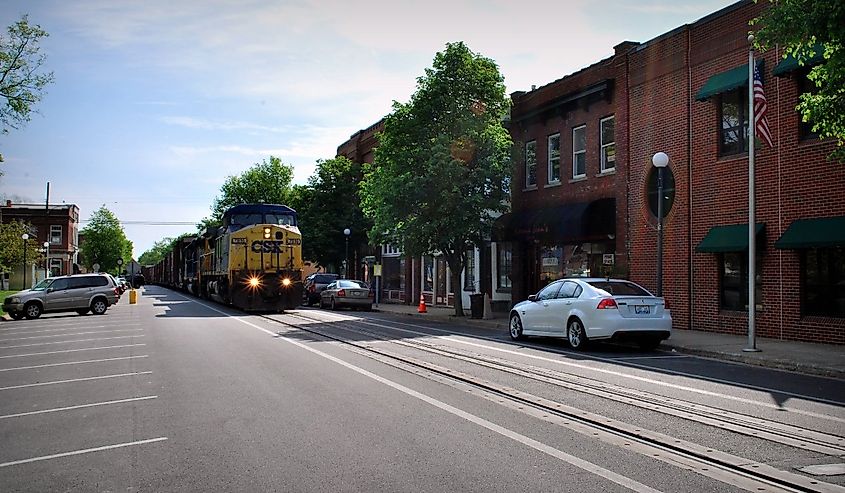 Train rolling along Main Street in La Grange, Kentucky, USA