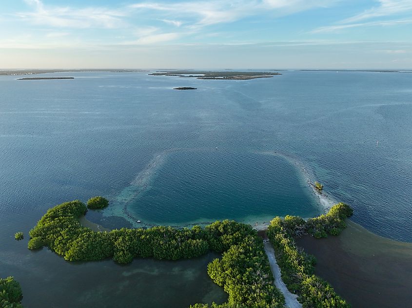Horseshoe beach and blue hole ocean along Florida Keys coast, an example of what the Green Banana Blue Hole would look like.