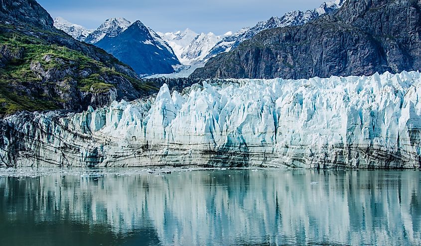 Close-up of Margerie Glacier in Glacier Bay National Park and Preserve in Southeast Alaska which is twenty-one miles long and one mile wide with layers of rock debris mixed with ice.
