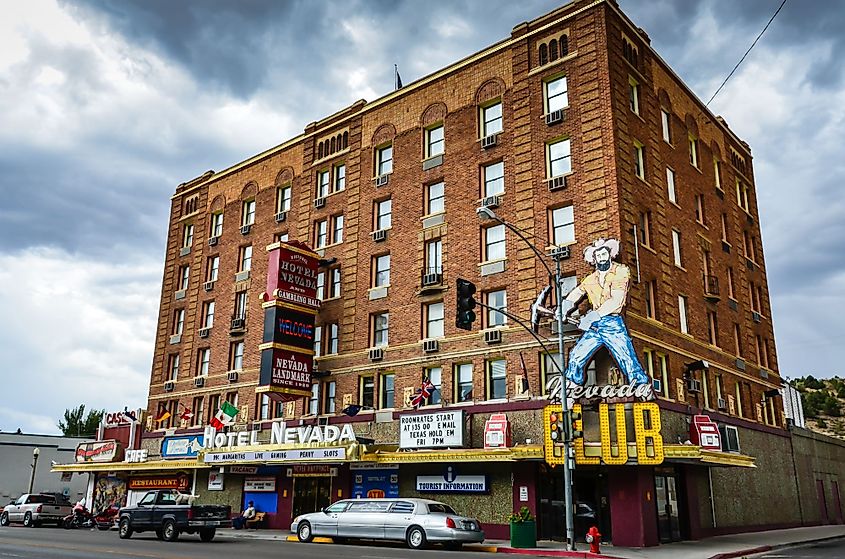 A stretch limousine is parked in front of the redbrick, Prohibition-era hotel and casino, Hotel Nevada in Ely, Nevada