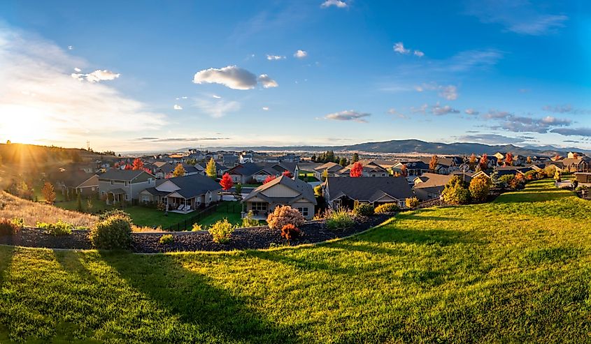 View of the city of Spokane Valley from a hilltop home in a subdivision during autumn.