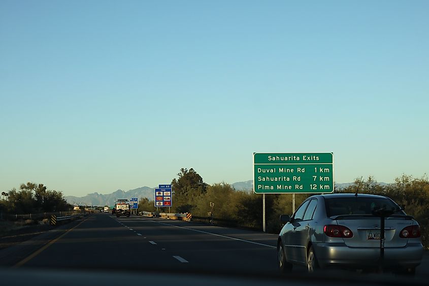 Highway signs giving distance in kilometers on Interstate 19