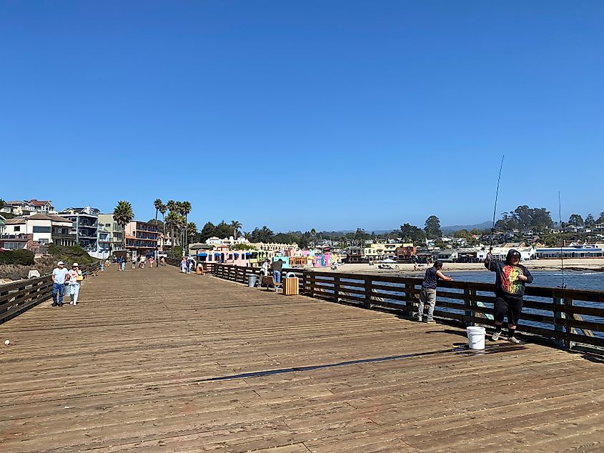 Walkers and fishermen taking advantage of a generous, beachside wharf.