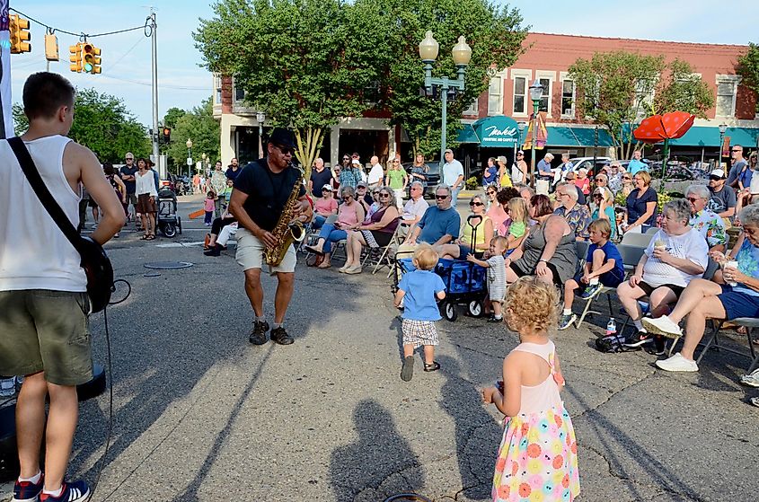 The residents of Chelsea enjoy a musical performance at the Chelsea Sounds and Sights Festival.