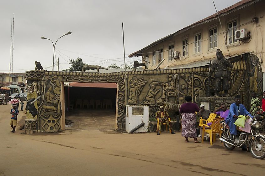 People in the street in front of a traditional building in the city of Akure. Editorial credit: Jordi C / Shutterstock.com