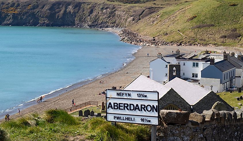 Aberdaron, Wales Beautiful landscape of the village, bay, sea and dramatic cliffs Small seaside resort with a quiet secluded beach with blue sea lapping on the sandy shore