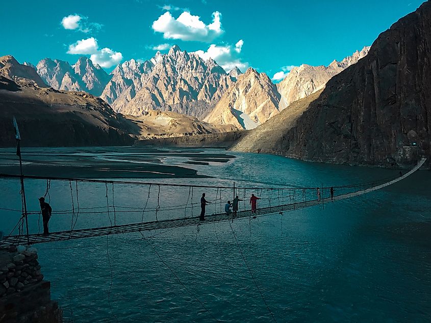 The karakarum mountain ranges and the most popular tourists spots Passucones and Hussaini suspension brigade with the Hunza river hunza north Pakistan.