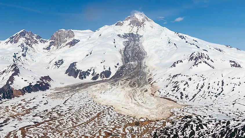 Aerial view of Mount Redoubt Volcano in Alaska with steam plumes