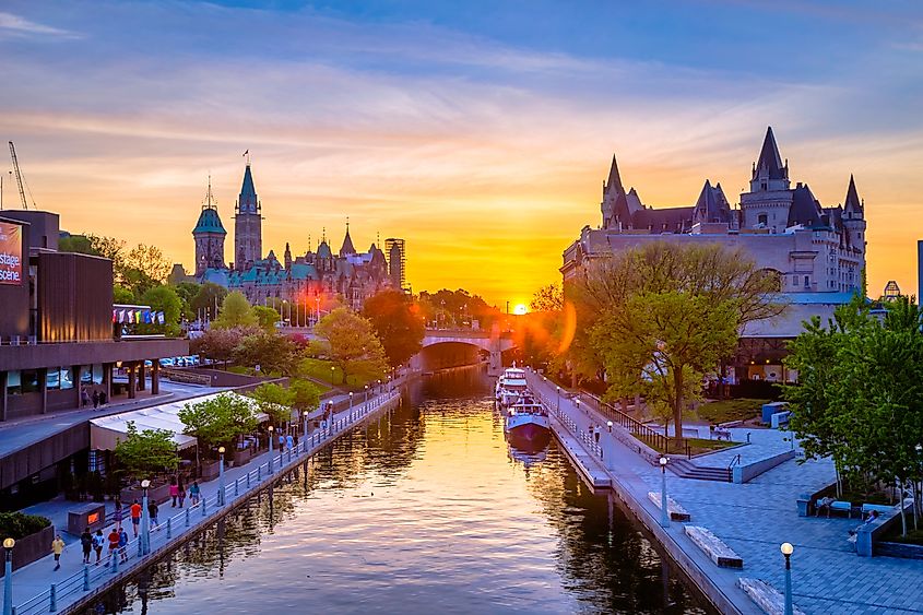 View of Ottawa city buildings and Rideau Canal from Mackenzie King Bridge during sunset (Aqnus Febriyant via Shutterstock)