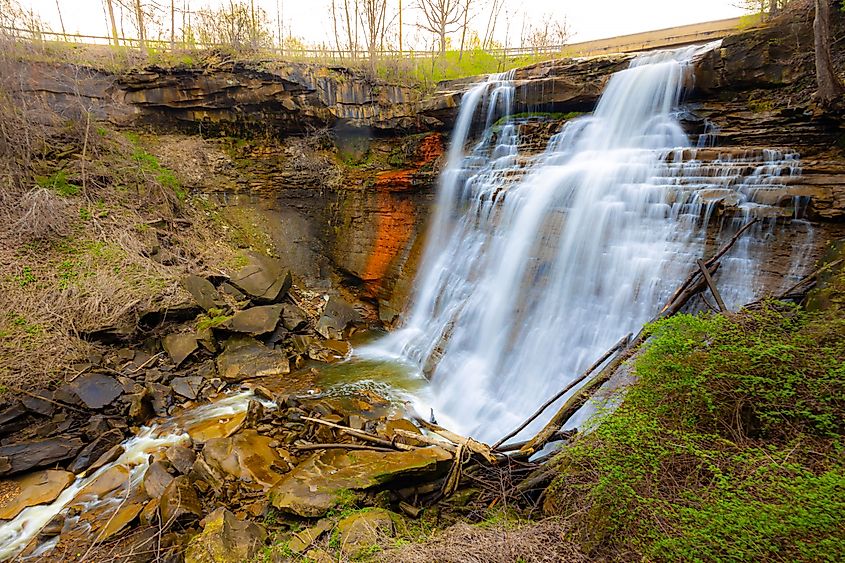 Brandywine Falls cascading into a rocky gorge surrounded by lush forest in Cuyahoga Valley National Park, Ohio.