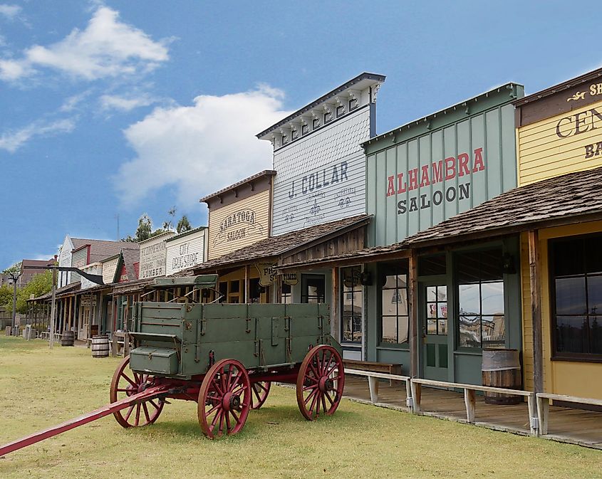 Façade of the Front Street replica with an old chuck wagon at the Boot Hill historical museum in Dodge City, Kansas. Editorial credit: RaksyBH / Shutterstock.com