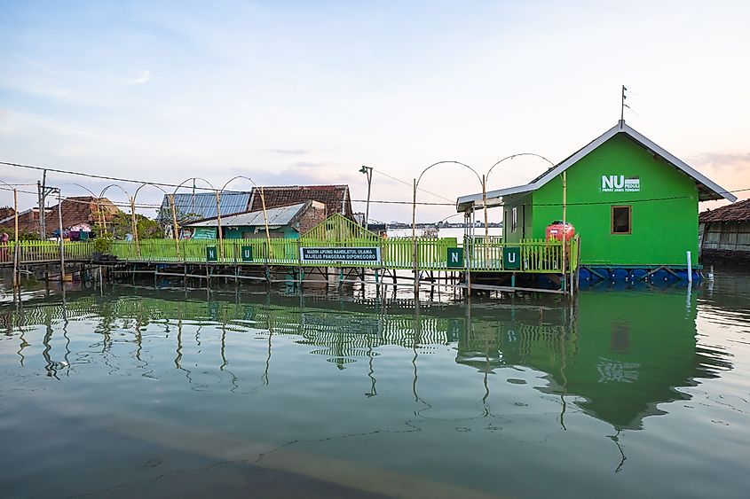 The afternoon atmosphere in the village affected by tidal flooding in Timbulsloko Village, Demak, Central Java.