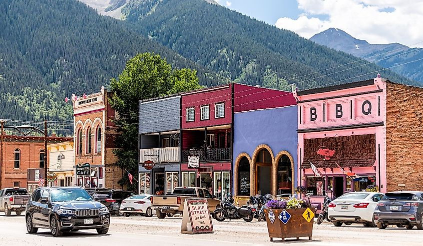 Small town village in Colorado with main road and colorful vibrant multicolored historic architecture houses and Blair street sign