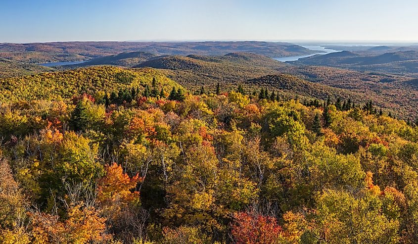 Colorful Autumn panoramic view south over West Mountain and the Great Sacandaga Lake from the Hadley Mountain fire tower in the Adirondack Mountains of New York