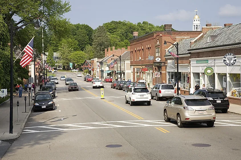 Storefronts in historic Concord on Memorial Day weekend with American Flags displayed