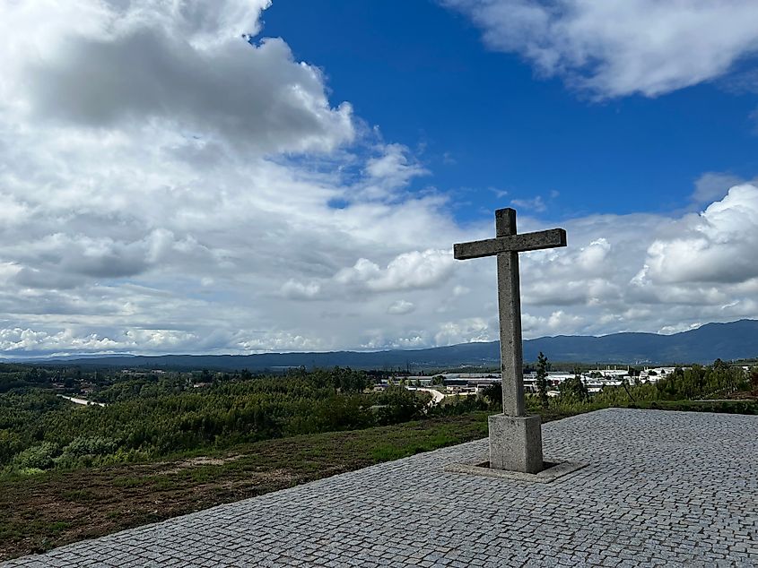 Stone cross on a hill overlooks the ancient old town. Our lady of hope in Tondela, Portugal. Via Shutterstock / Photograph By Ana Paula