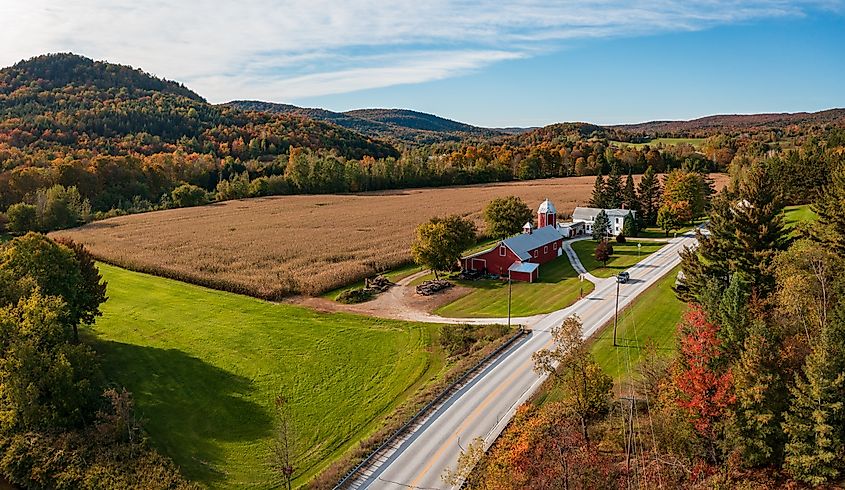 Aerial view of large red farm barn by the side of the road near Montgomery in Vermont