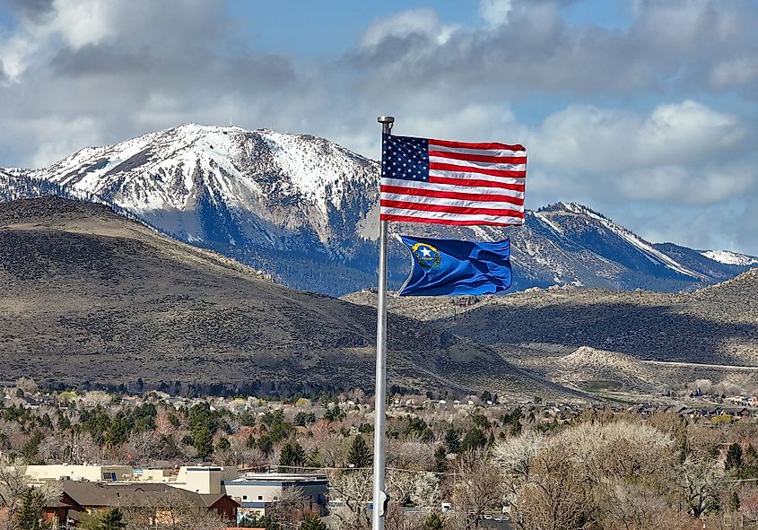 Slide Mountain as seen from Carson City, Nevada. Slide Mountain, Nevada behind a waving US & Nevada State flag. Taken from Carson City, Nevada.