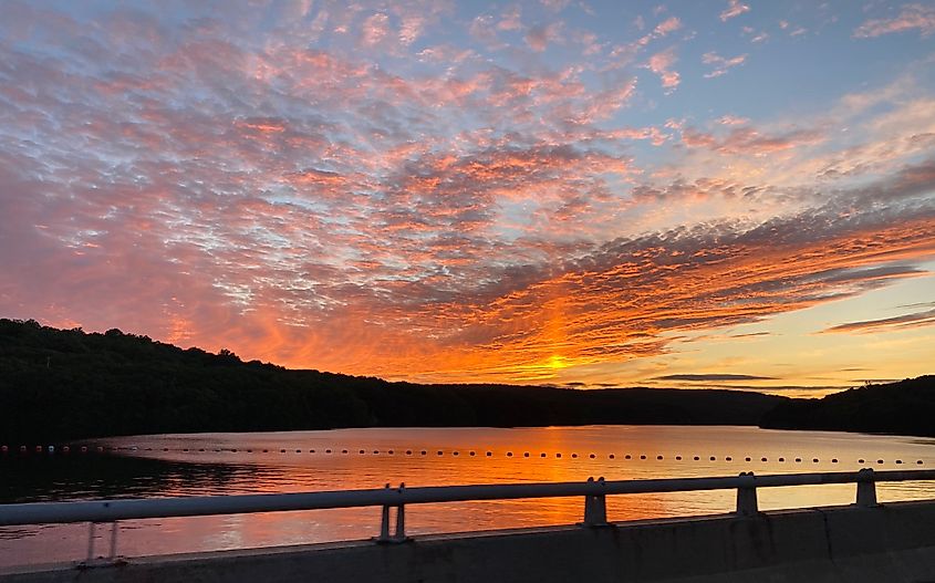 Sunset over the Stevenson Dam in Connecticut. View overlooks Lake Zoar with the hills of Newtown and Oxford in the distance.