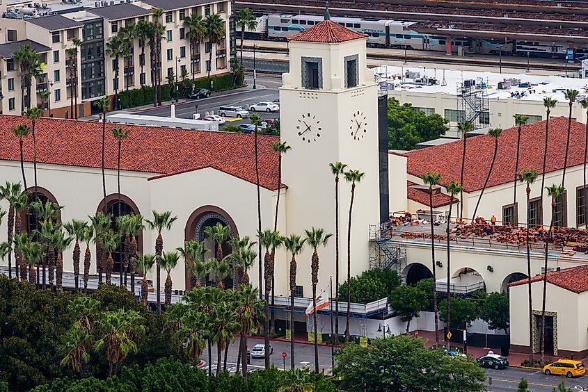 Los Angeles Union Station with its clock tower and palm trees.