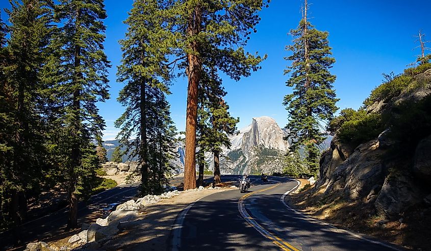 Motorcyclists pass Half Dome on the way back to Yosemite Valley from Glacier Point, in Yosemite National Park in Groveland.