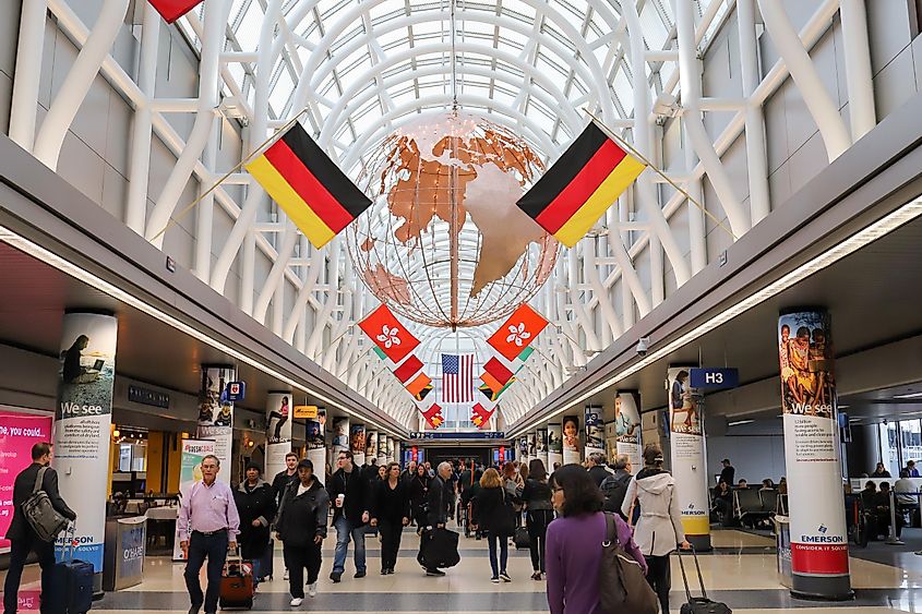 Travelers walk inside a terminal of the O’Hare International Airport