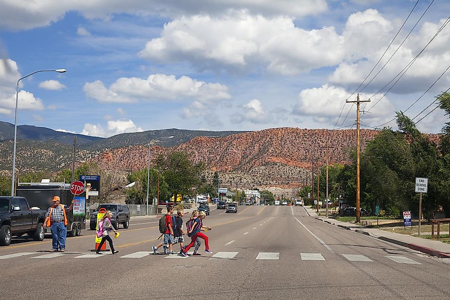 Kids crossing the street in Cedar City, Utah, via stellalevi / iStock.com