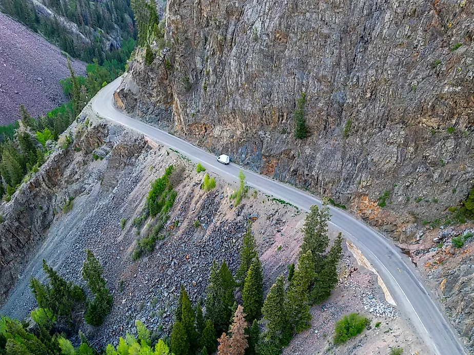 A lone vehicle drives along the dangerous Million Dollar Highway at Ouray, Colorado