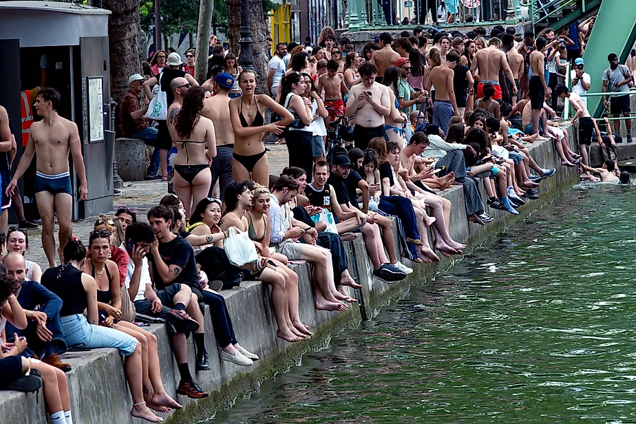 Parisians swim in the Saint Martin canal on a sweltering day