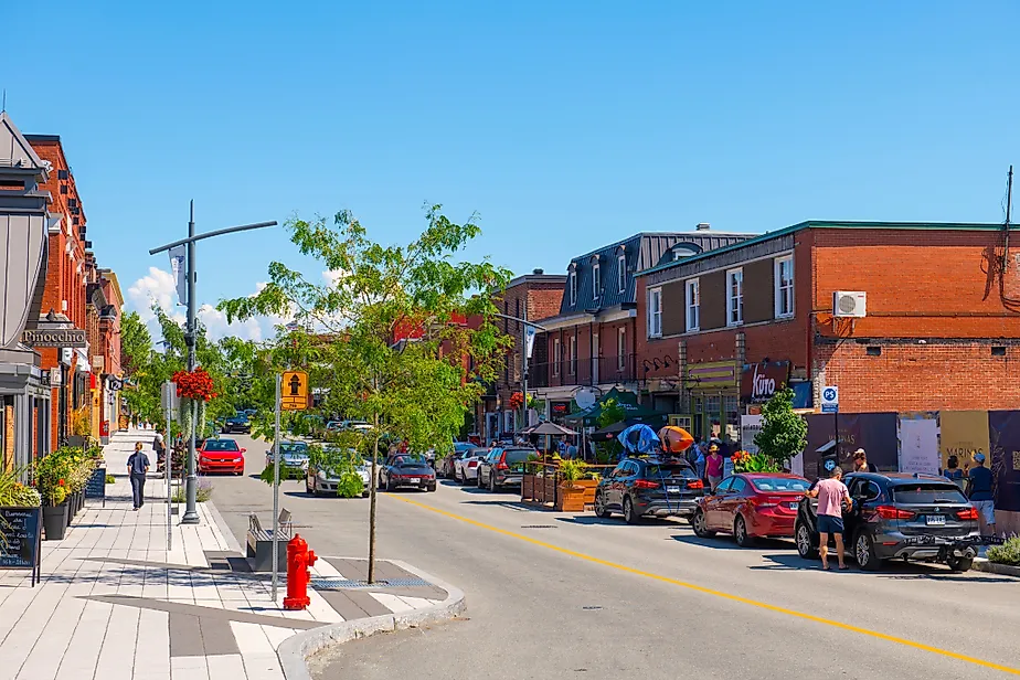 Historic commercial buildings on Rue Principale O Street in downtown Magog, Quebec.