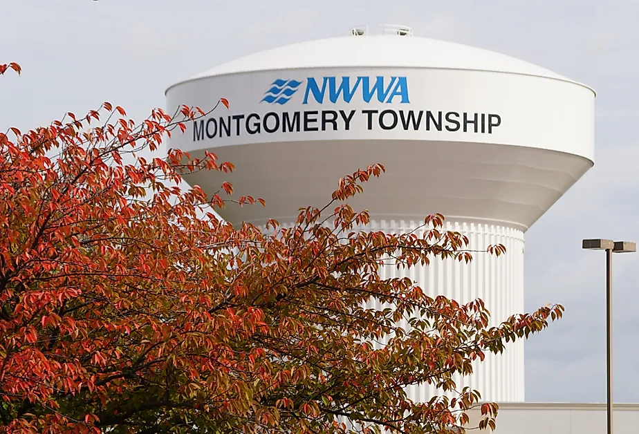 The water tower of NWWA Montgomery Township with the fall foliage, Pennsylvania. Image credit Khairil Azhar Junos via Shutterstock
