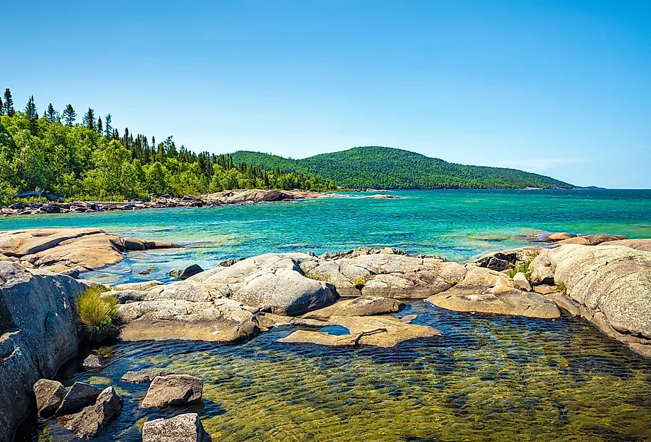 Trees, rocks, forest and Lake on the Under the Volcano Trail along the beautiful rocky coast of Lake Superior at Neys Provincial Park, Ontario, Canada