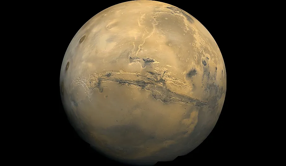 Valles Marineris stretches over 4,000 km (2,500 mi) across Mars. By NASA / USGS (see PIA04304 catalog page) - http://nssdc.gsfc.nasa.gov/photo_gallery/photogallery-mars.html http://nssdc.gsfc.nasa.gov/image/planetary/mars/marsglobe1.jpg, Public Domain, ht