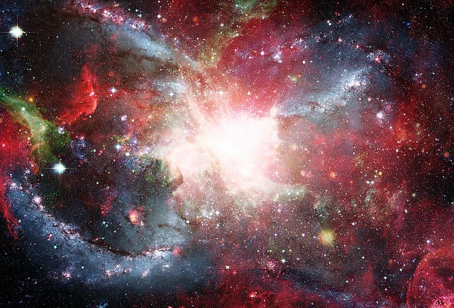 Open space filled with stars, nebulae and galaxies.