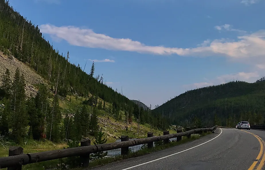 The Grand Loop Road in Yellowstone National Park is known as one of the first public use roads throughout a park. Credit: Helena Whitmore/ Shutterstock.com