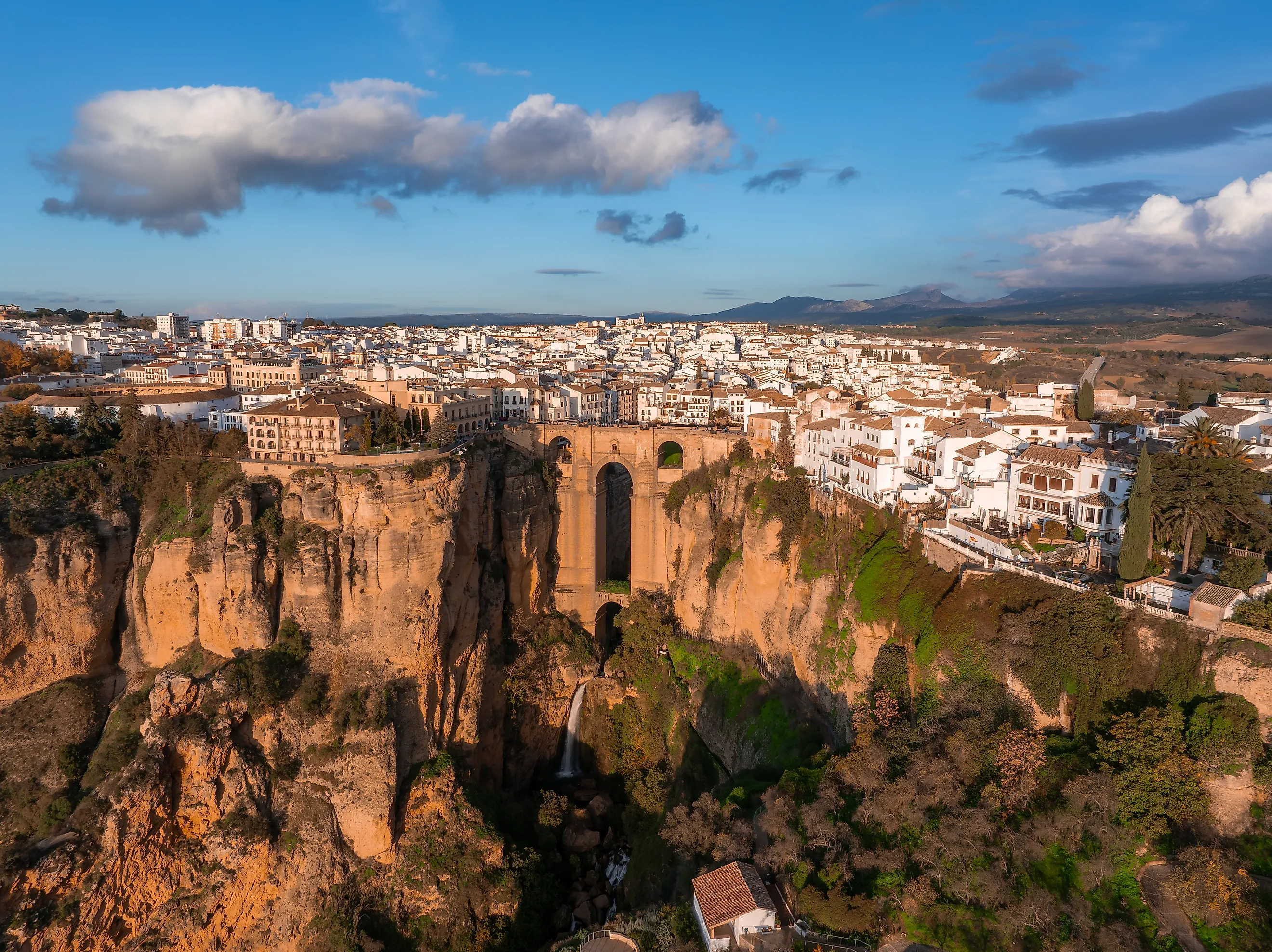 Aerial image of Ronda, Spain, showcasing Puente Nuevo bridge over El Tajo gorge. 
