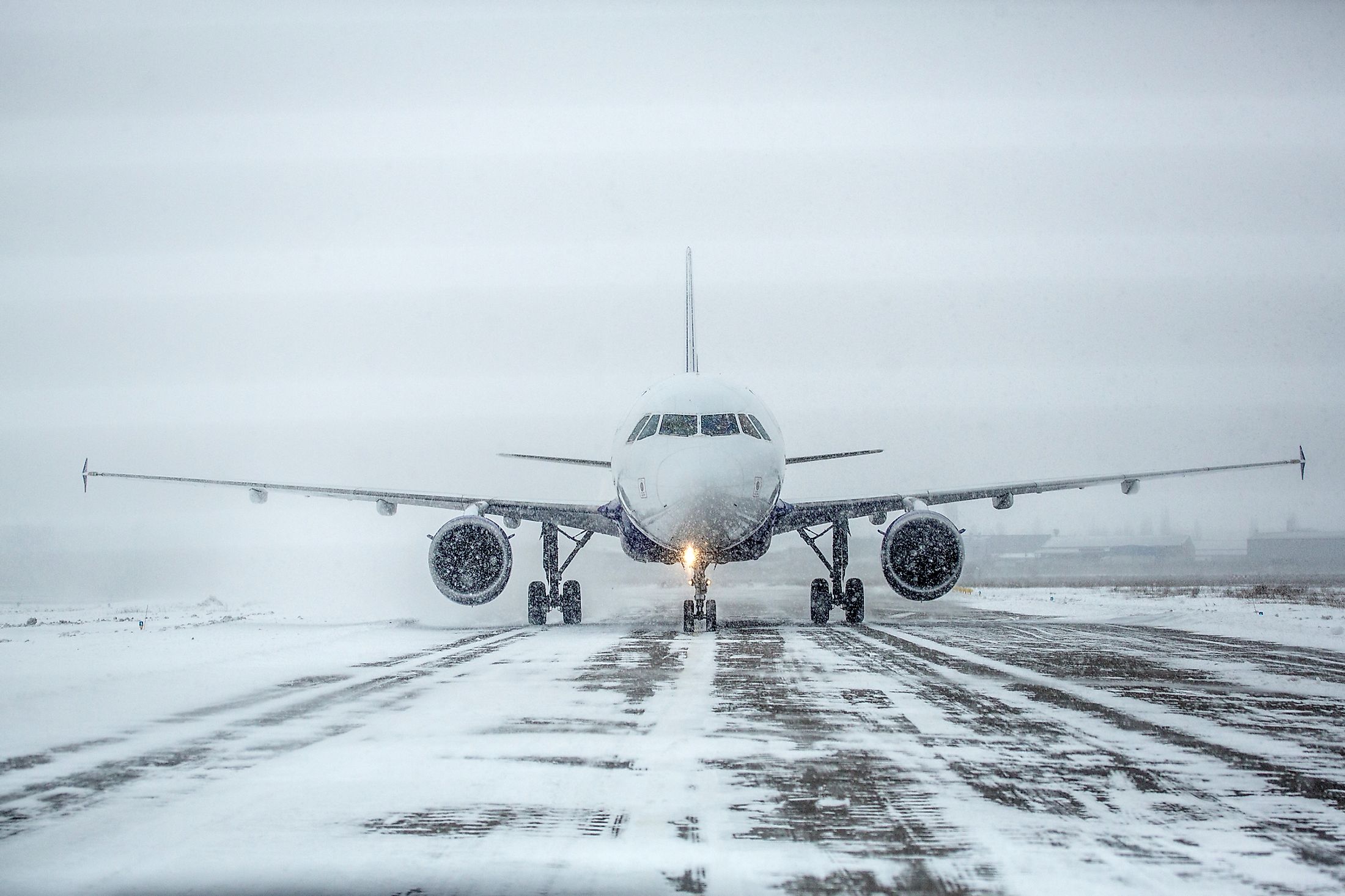 A plane landing in a blizzard.